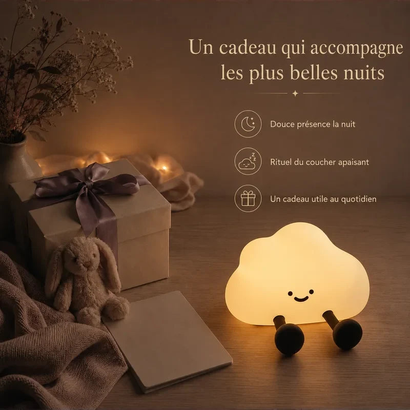 Veilleuse en forme de nuage présentée dans une ambiance cadeau avec une boîte et un ruban.