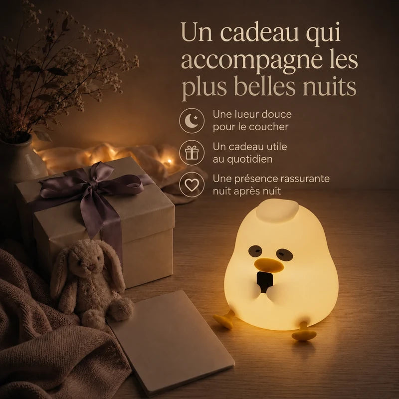 Veilleuse canard assis présentée dans une ambiance cadeau.