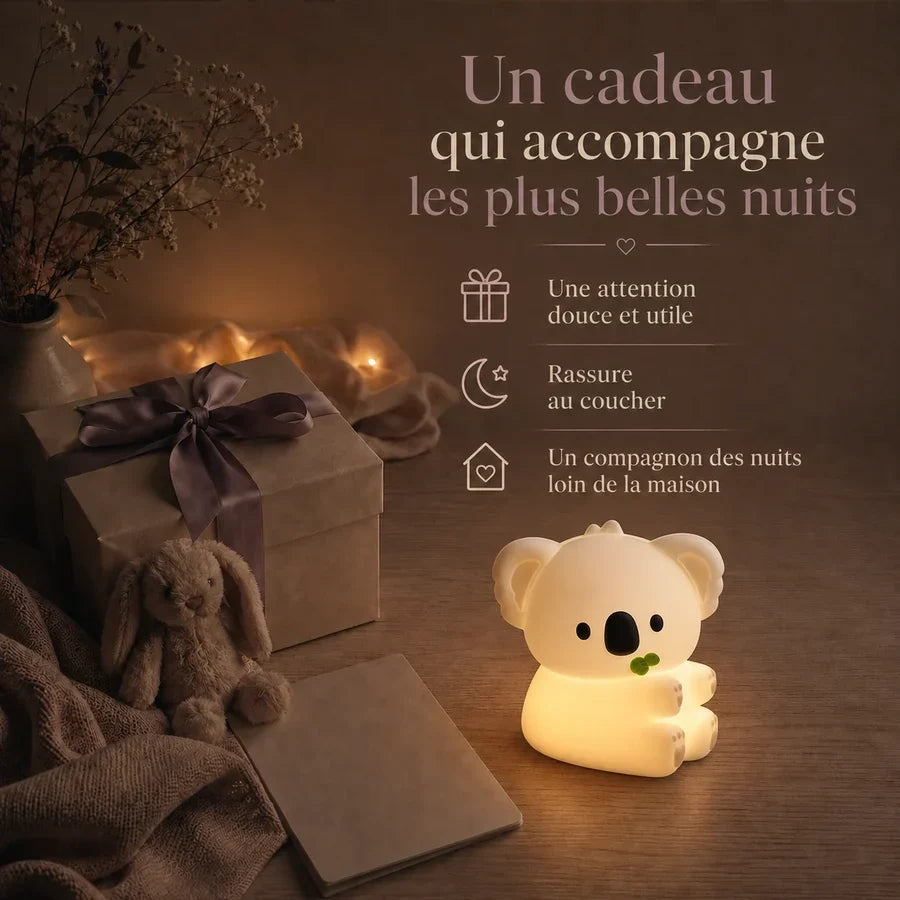 Veilleuse koala avec une feuille d’eucalyptus présentée dans une ambiance cadeau avec une boîte et un ruban.
